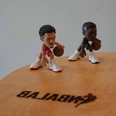 basketball player figurines on an NBALab table